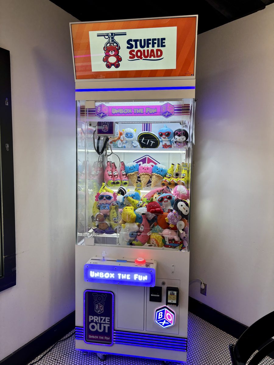 A Stuffie Squad claw machine stocked with plush prizes